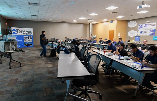 Tempo Mechanical HVAC professionals participating in hands-on technical training at the company’s training facility to Multifamily Customers.